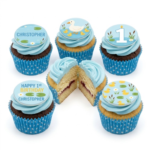 Duck pond themed 1st birthday cupcakes with blue frosting and custom name topper.