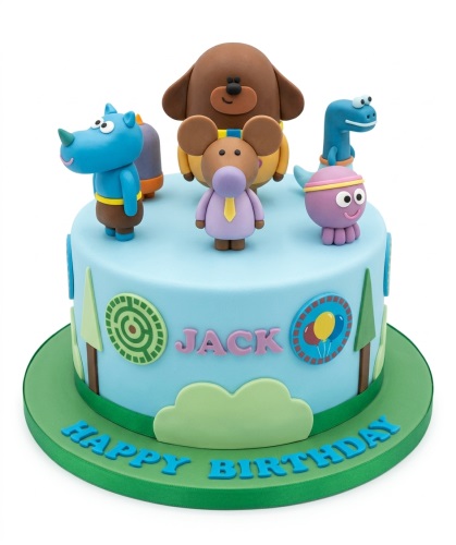 Light blue Hey Duggee themed birthday cake with fondant characters and green base.