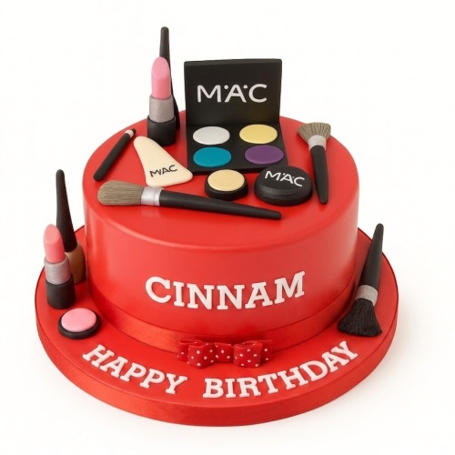 Red round birthday cake with MAC makeup decorations and personalised message.