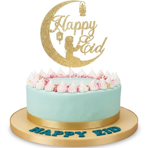 Round light blue cake with white and pink piped icing, gold ribbon, and a glittery gold 'Happy Eid' crescent moon topper with lanterns and a praying figure.