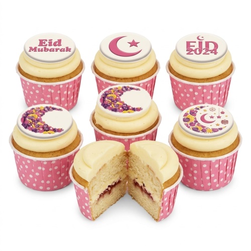 A selection of Eid Mubarak cupcakes with crescent moon and star toppers in pink polka dot wrappers.