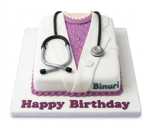 White lab coat birthday cake with purple top, pearl necklace, and edible stethoscope.