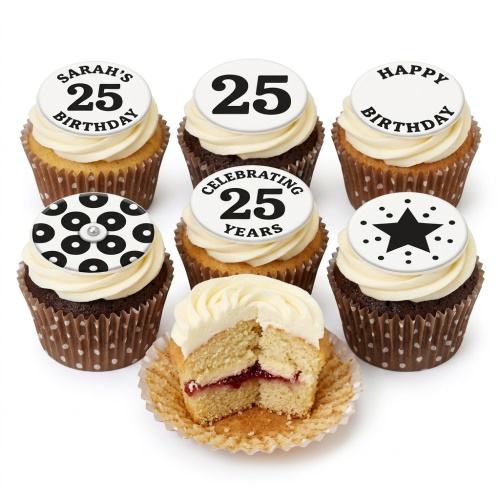 Black and white birthday cupcakes with custom age and star toppers, one cut open showing vanilla sponge and jam.
