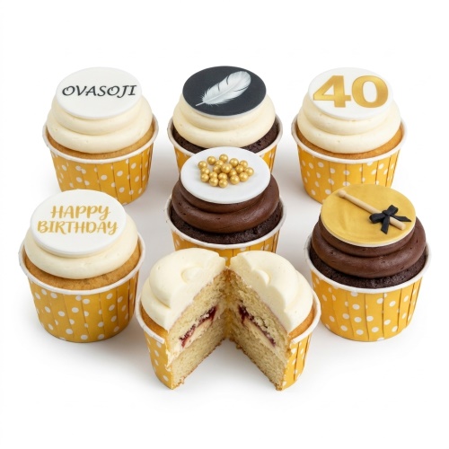 A selection of personalised birthday cupcakes with custom name, age, feather, and drum toppers.
