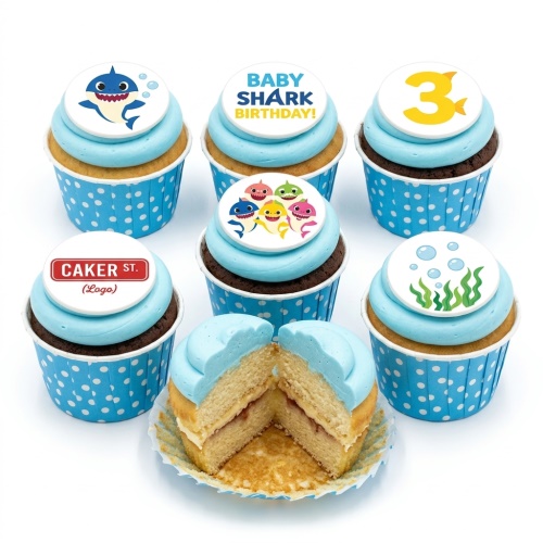 Baby Shark themed birthday cupcakes with blue frosting, character toppers, and a custom age topper.