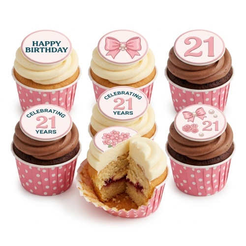 Six cupcakes with pink polka dot wrappers, white and chocolate frosting, topped with pink bows, flowers, 'Happy Birthday', and '21' toppers.