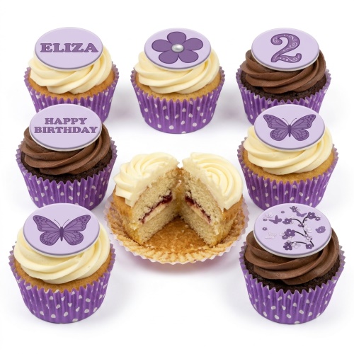 Assortment of purple and white butterfly and floral birthday cupcakes with custom age topper.