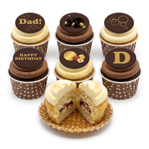 Six chocolate and vanilla cupcakes with chocolate discs, gold accents, hazelnuts, and 'Happy Birthday' message.