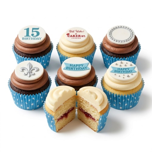 Assorted birthday cupcakes with chocolate and vanilla frosting, blue polka dot wrappers, and customisable toppers including a custom age.