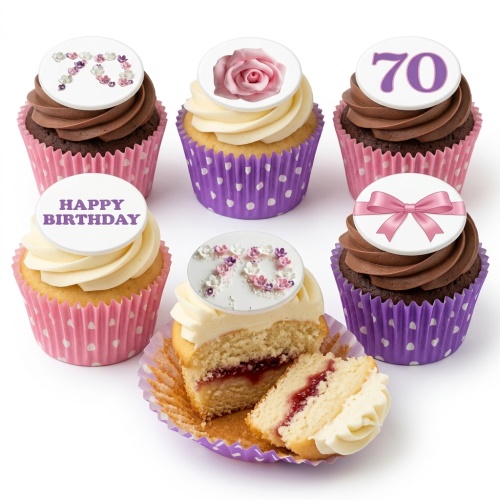 Assortment of vanilla and chocolate cupcakes with floral, bow, and custom age toppers.