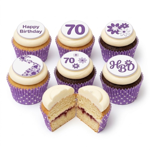 Six birthday cupcakes with purple and white floral designs, 'Happy Birthday', '70', and 'HBD' toppers. One cupcake is cut in half revealing jam filling.