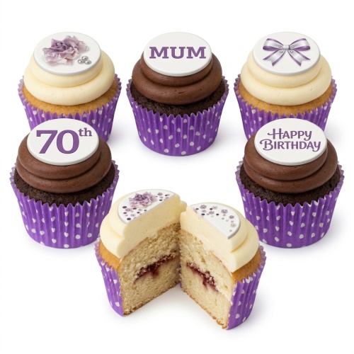 Elegant cupcakes with purple floral, bow, and custom message toppers in polka dot wrappers.