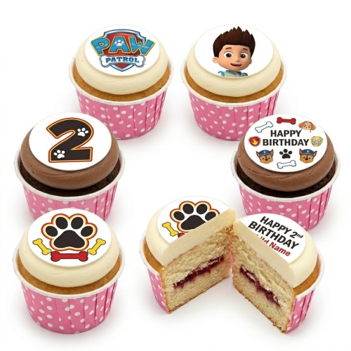 Paw Patrol themed cupcakes with Ryder, logo, paw prints, and bones. Features custom age and personalised name toppers.