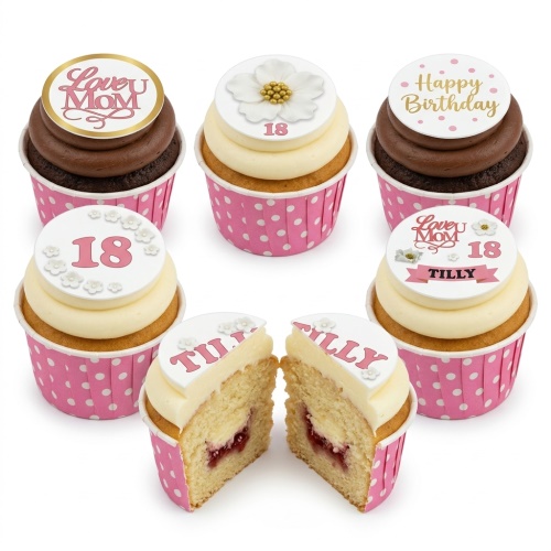 Six birthday cupcakes with white and chocolate icing, pink polka dot wrappers, and edible toppers with flowers, 'Happy Birthday', 'Love U Mom', and custom age.