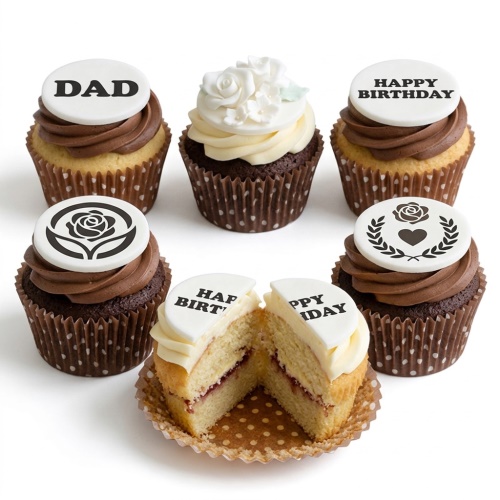 A selection of personalised birthday cupcakes with custom message and floral toppers, featuring chocolate and vanilla frosting.