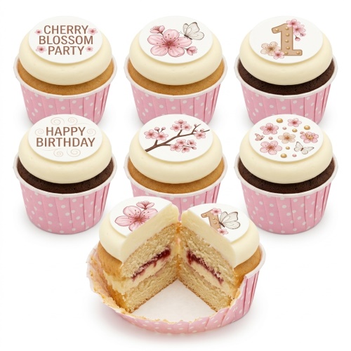 White cupcakes with cherry blossom and butterfly toppers in pink polka dot cases.