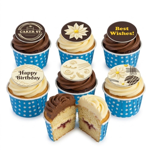 Assorted cupcakes with chocolate and vanilla frosting, blue polka dot cases, and decorative toppers including "Happy Birthday" and floral designs.