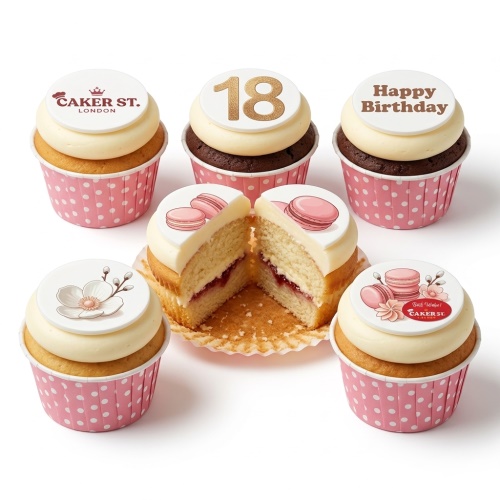 Assortment of ladies birthday cupcakes with floral, macaron, and custom age toppers