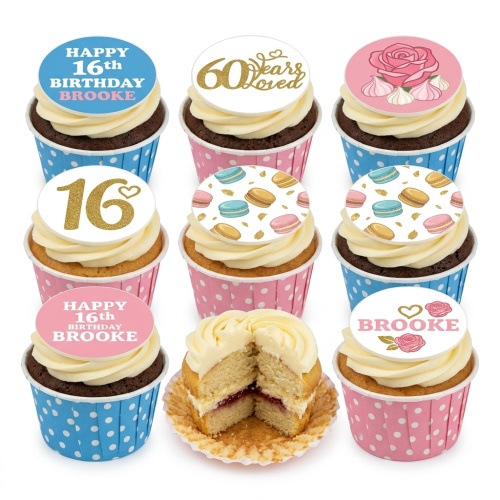Assortment of ladies birthday cupcakes with floral, macaron, and custom age toppers in pink and blue cases.
