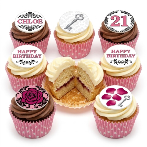 Elegant birthday cupcakes with pink polka dot wrappers, white and chocolate frosting, topped with a pink rose, silver key, and customisable 'Happy Birthday' and name/age toppers.