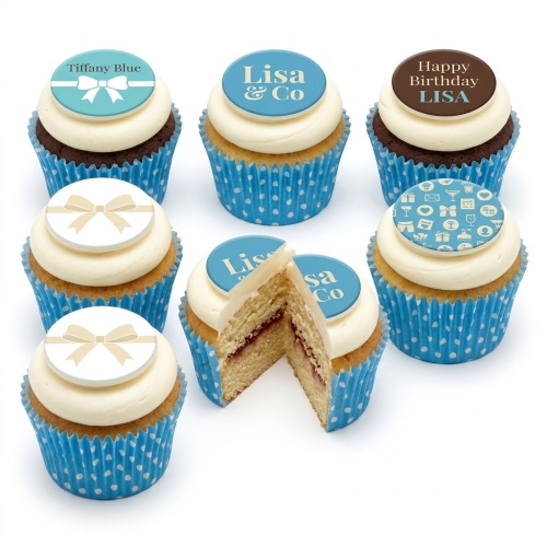 Elegant cupcakes with blue and white frosting, bow toppers, and celebration icons.