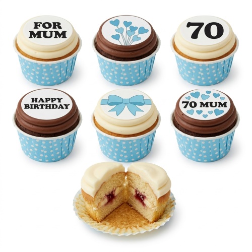 A selection of vanilla and chocolate cupcakes with white and brown icing, decorated with blue hearts, a blue bow, and customisable birthday messages like 'FOR MUM', 'HAPPY BIRTHDAY', and '70'.