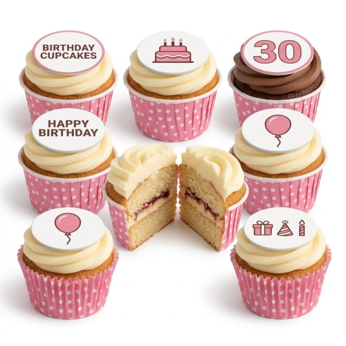 Birthday cupcakes with custom age and celebration toppers in pink polka dot wrappers.