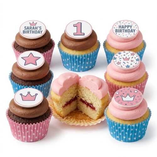 Assortment of Princess Crown Birthday Cupcakes with pink and blue wrappers, featuring crown and star toppers, and a cut cupcake with jam filling.