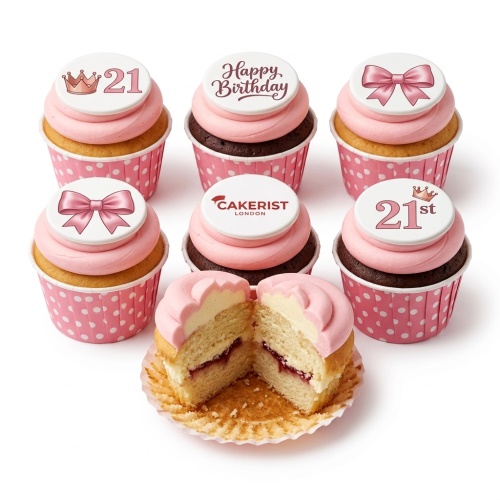 Pink birthday cupcakes with crown and bow toppers, some with 'Happy Birthday' message and custom age.
