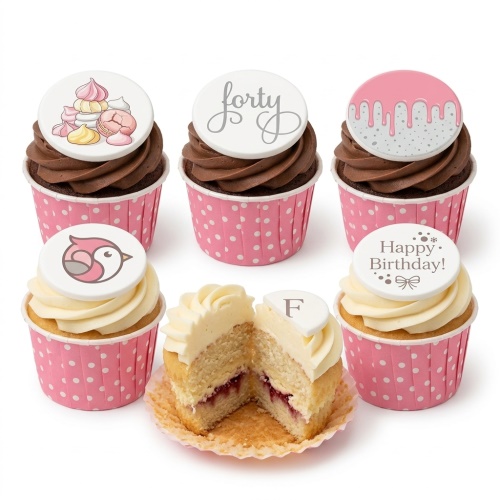 Pink polka dot cupcakes with chocolate and vanilla frosting, featuring custom age, birthday message, and decorative toppers.