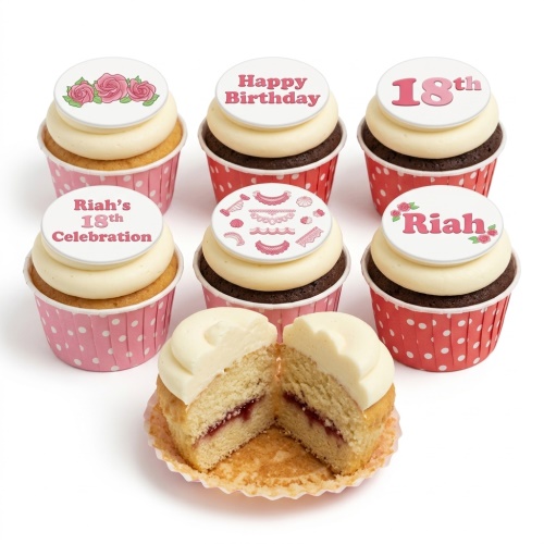 Six cupcakes with white frosting, pink polka dot wrappers, and edible toppers featuring roses, Happy Birthday, and custom age.