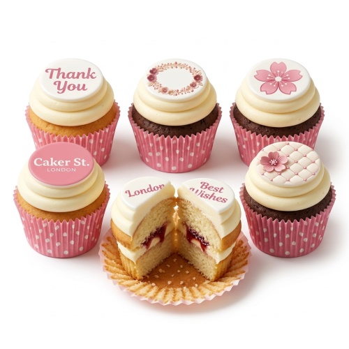 A set of Thank You cupcakes with white and pink frosting, decorated with floral patterns and messages like 'Thank You' and 'Best Wishes'.