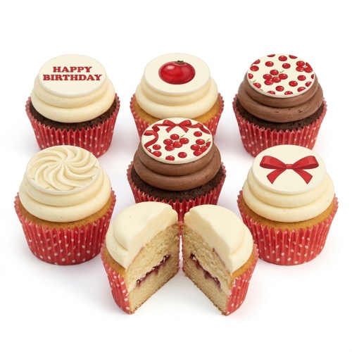 Set of red berry and bow themed birthday cupcakes with white and chocolate frosting in red polka dot cases.