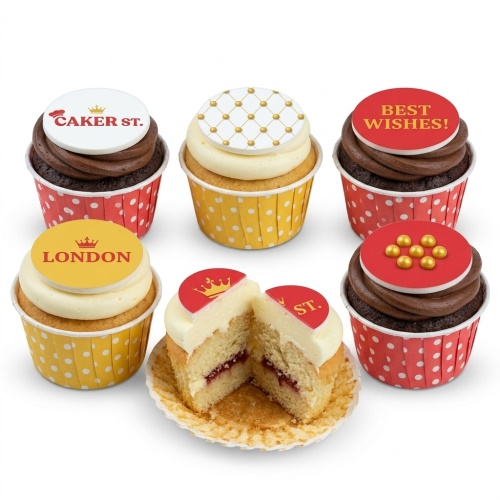 Assortment of celebration cupcakes with 'Best Wishes' and 'London' toppers, gold patterns, and edible pearls.