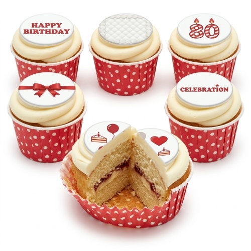 White cupcakes with red and white polka dot cases and various celebration toppers including "Happy Birthday" and custom age 80.