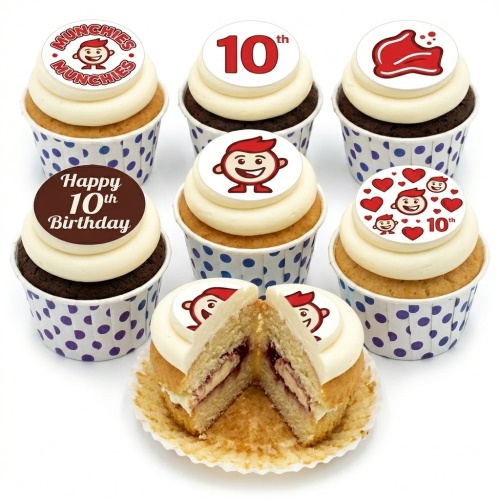 Munchies themed cupcakes with a cartoon boy character, 10th birthday toppers, and hearts, in blue polka dot wrappers.