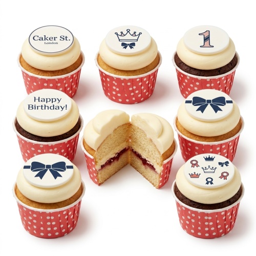Elegant cupcakes with white frosting, red polka dot cases, and white toppers featuring navy crowns and bows.