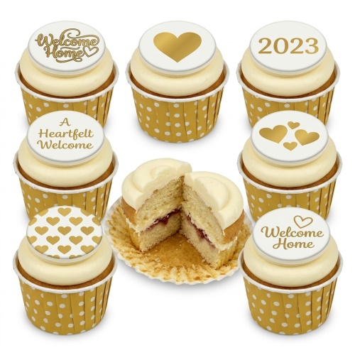 Gold and white cupcakes with "Welcome Home" messages, hearts, and a custom year topper.