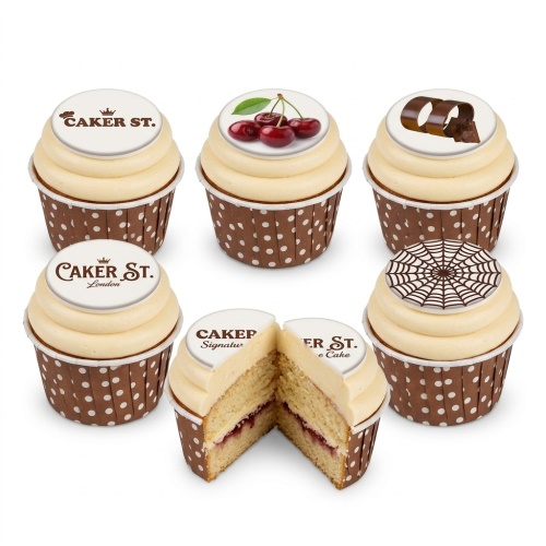 Round yellow glaze cupcakes with chocolate web pattern, chocolate curls, shards, and red cherries.