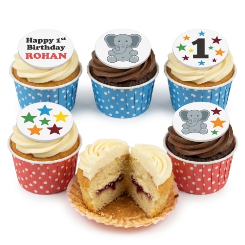 Set of 1st birthday cupcakes with elephant and star toppers, featuring vanilla and chocolate frosting.