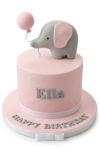 Pink round birthday cake with a grey elephant and pink balloon topper, white ribbon, and personalised name.