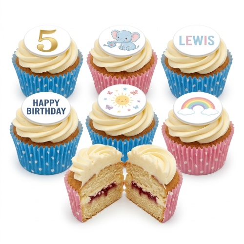 Vanilla cupcakes with white frosting, featuring cute elephant, sun, rainbow, and custom age toppers in pink and blue cases.