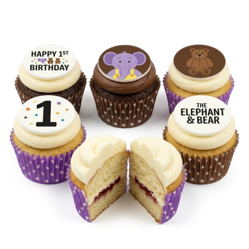 Set of 1st Birthday cupcakes with elephant, bear, and 'Happy 1st Birthday' toppers on vanilla and chocolate frosting.