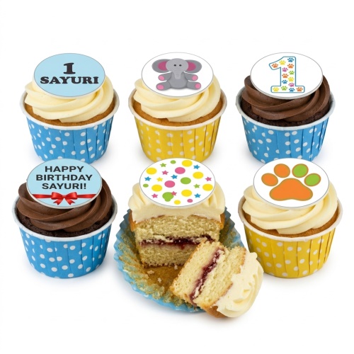 Assorted baby birthday cupcakes with elephant, paw print, and colourful dot toppers, with a custom age example.