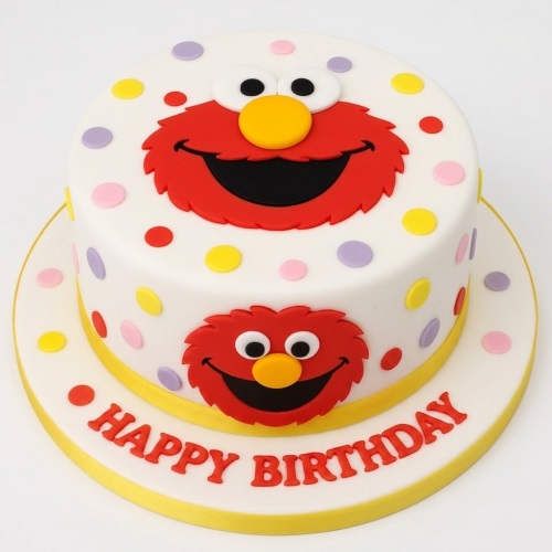 Two-tier white birthday cake with red Elmo faces and colourful polka dots.