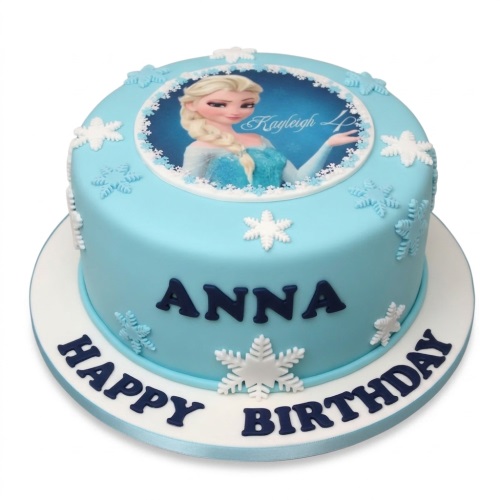 Round light blue Frozen Elsa birthday cake with white and light blue snowflake decorations.