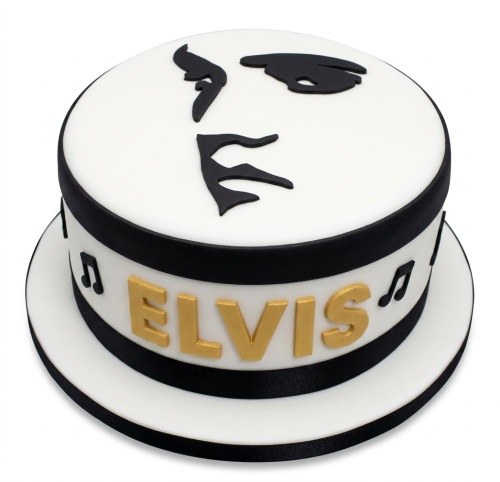 Round white and black cake with Elvis Presley silhouette on top and 'ELVIS' in gold on the side with musical notes.