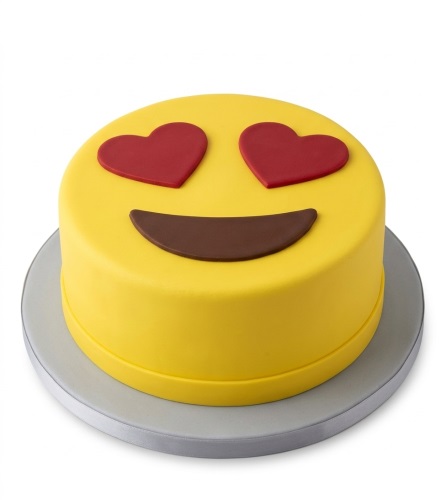 Round yellow cake with red heart eyes and a brown smile, resembling the heart eyes emoji.