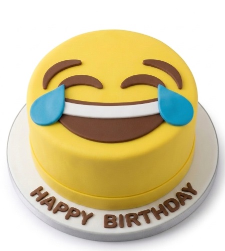 Round yellow cake with a laughing emoji face and 'Happy Birthday' message on the base.