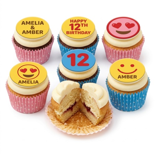 Six cupcakes with white frosting and round edible toppers featuring emojis, custom names, and a custom age. Some cupcakes have pink polka dot cases, others blue polka dot cases. One cupcake is cut open to show a jam filling.